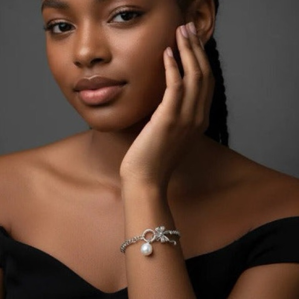 Elegant Silver tone Bracelet with Bow and Pearl Charms
